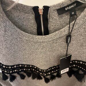 NWT Studio F Sweater. Color Grey. Size XS. Front and Back tassels.